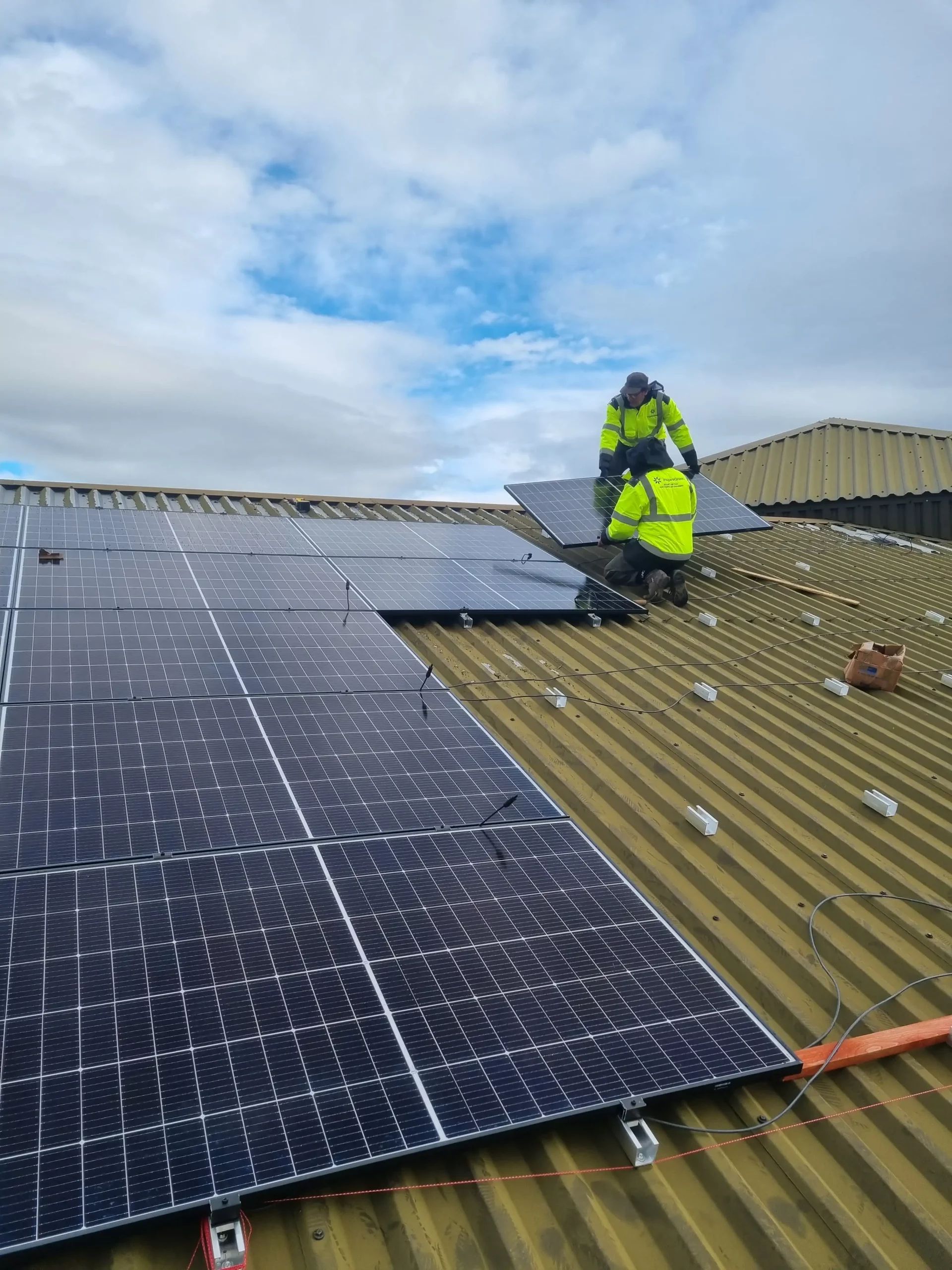 InspireGreen workers install a 32kwp array on a car dealership in Hereford, England.