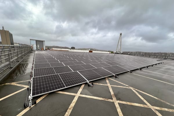 Solar panels installed by InspireGreen on a car park roof.