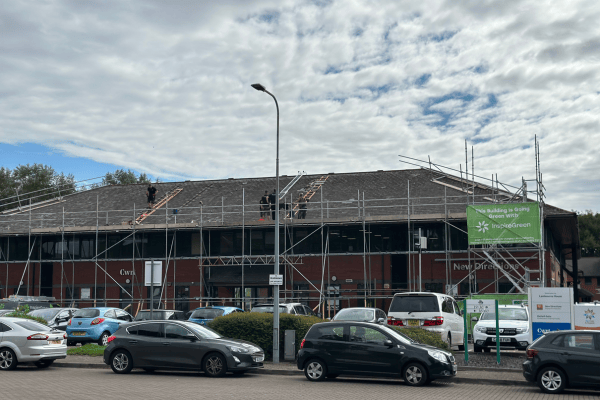 The InspireGreen team begins pre-installation work on the roof of the New Directions office.