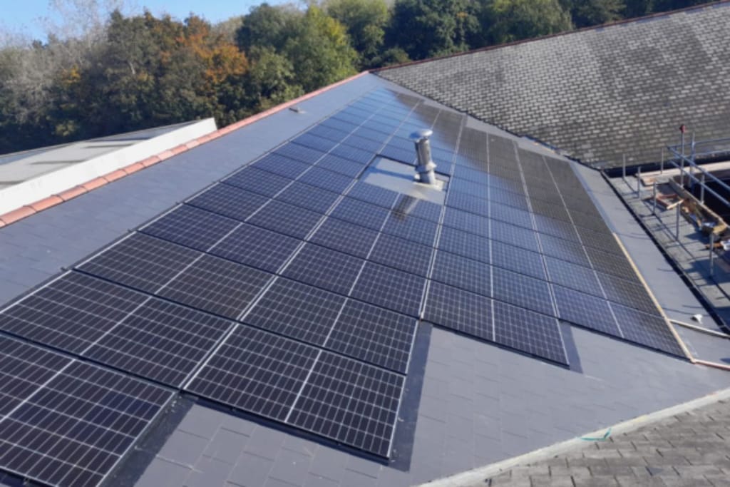 Integrated solar panels on the pitched roof of the New Directions office.
