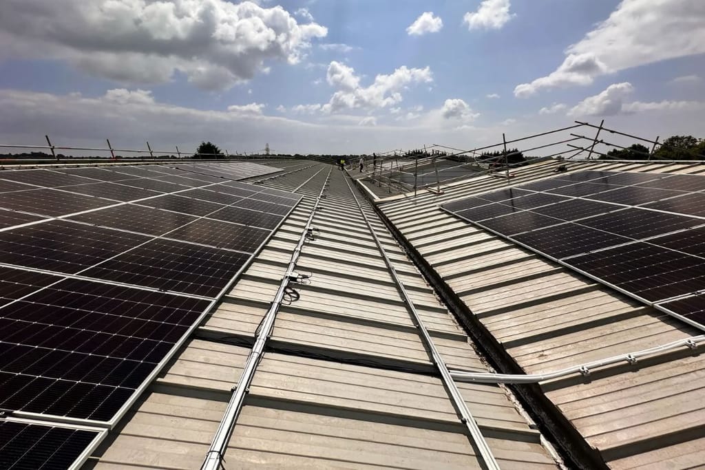 Solar panels being attached to rails on the Vision Court roof.